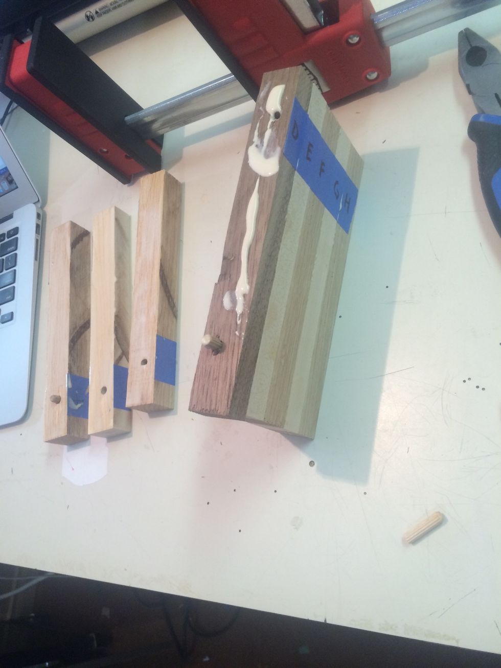 Add glue and dowels to the up facing piece of G