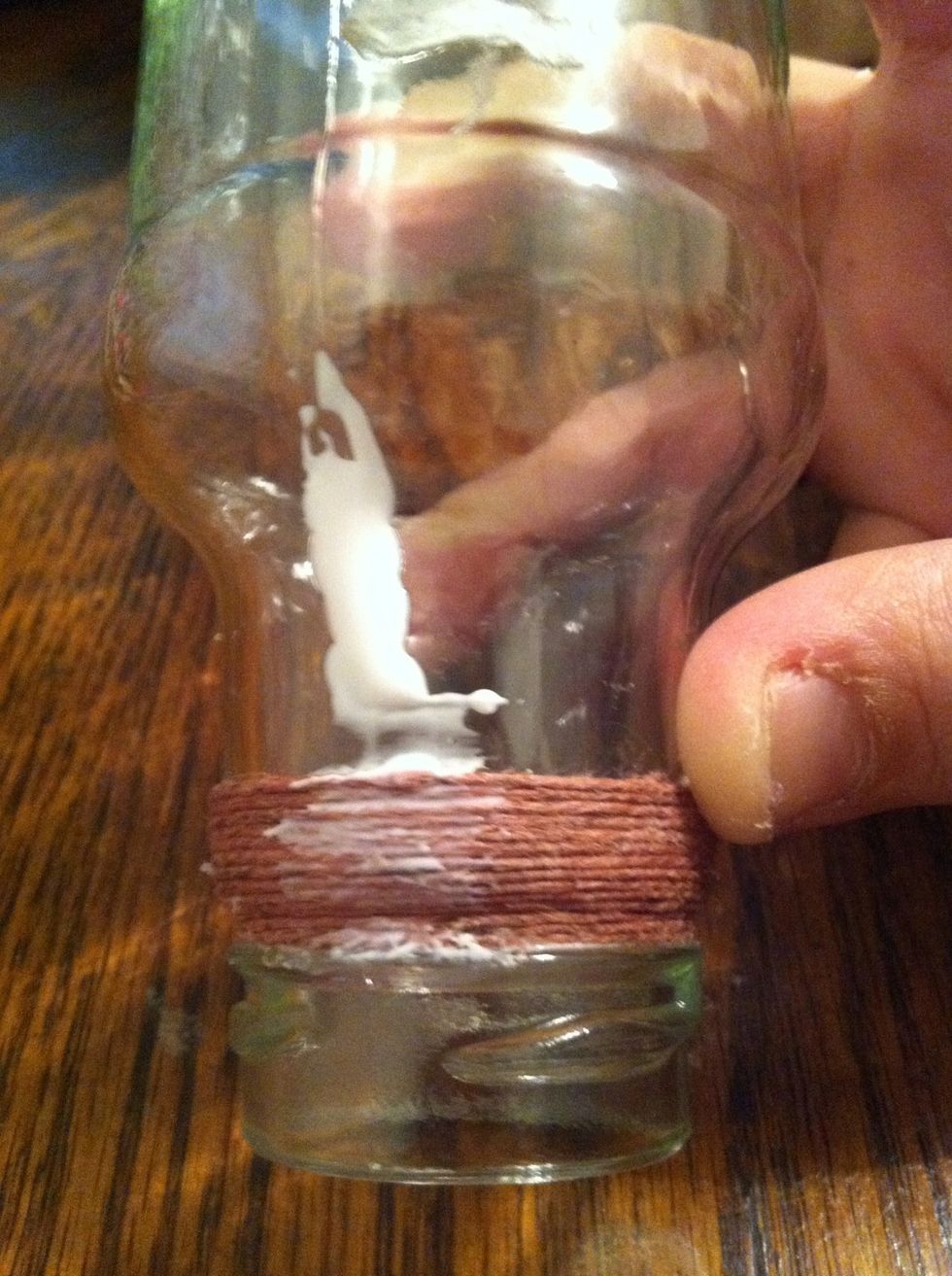 Add glue and keep wrapping and smoothing. The thicker it's on there the more you will notice it. I smoothed this more after taking the picture. And I added too much glue, you only need a dot.