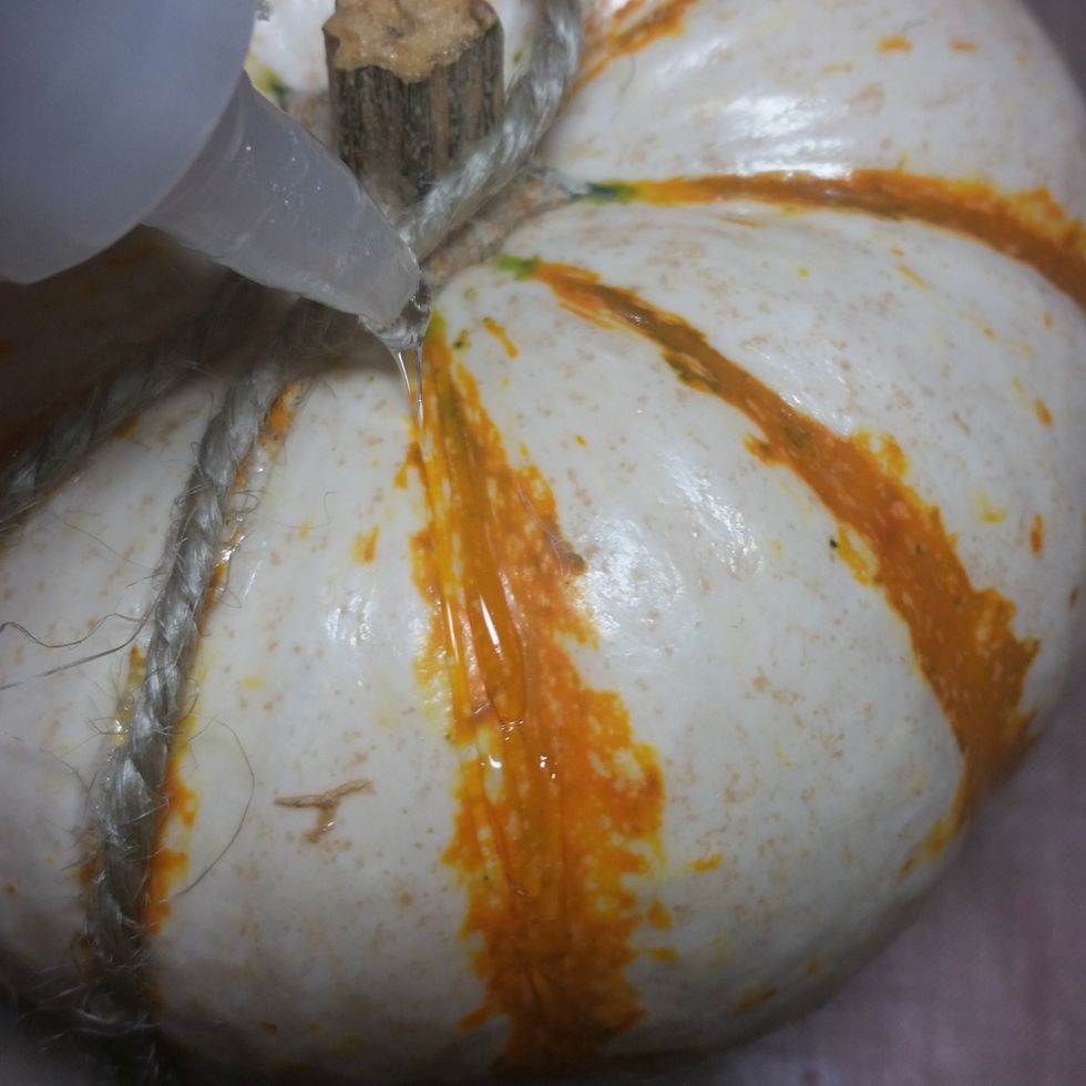 Add glue to the next groove and repeat the same procedure until the entire pumpkin had rope going up and down.