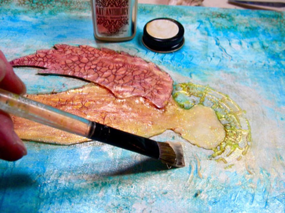 Add Gold Metal Effects to the halo and around the angel silhouette to create a glowing effect. I also added it around the canvas to add highlights here and there.