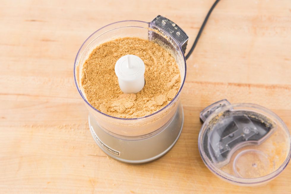 Add graham crackers to a food processor and pulse to make crumbs.