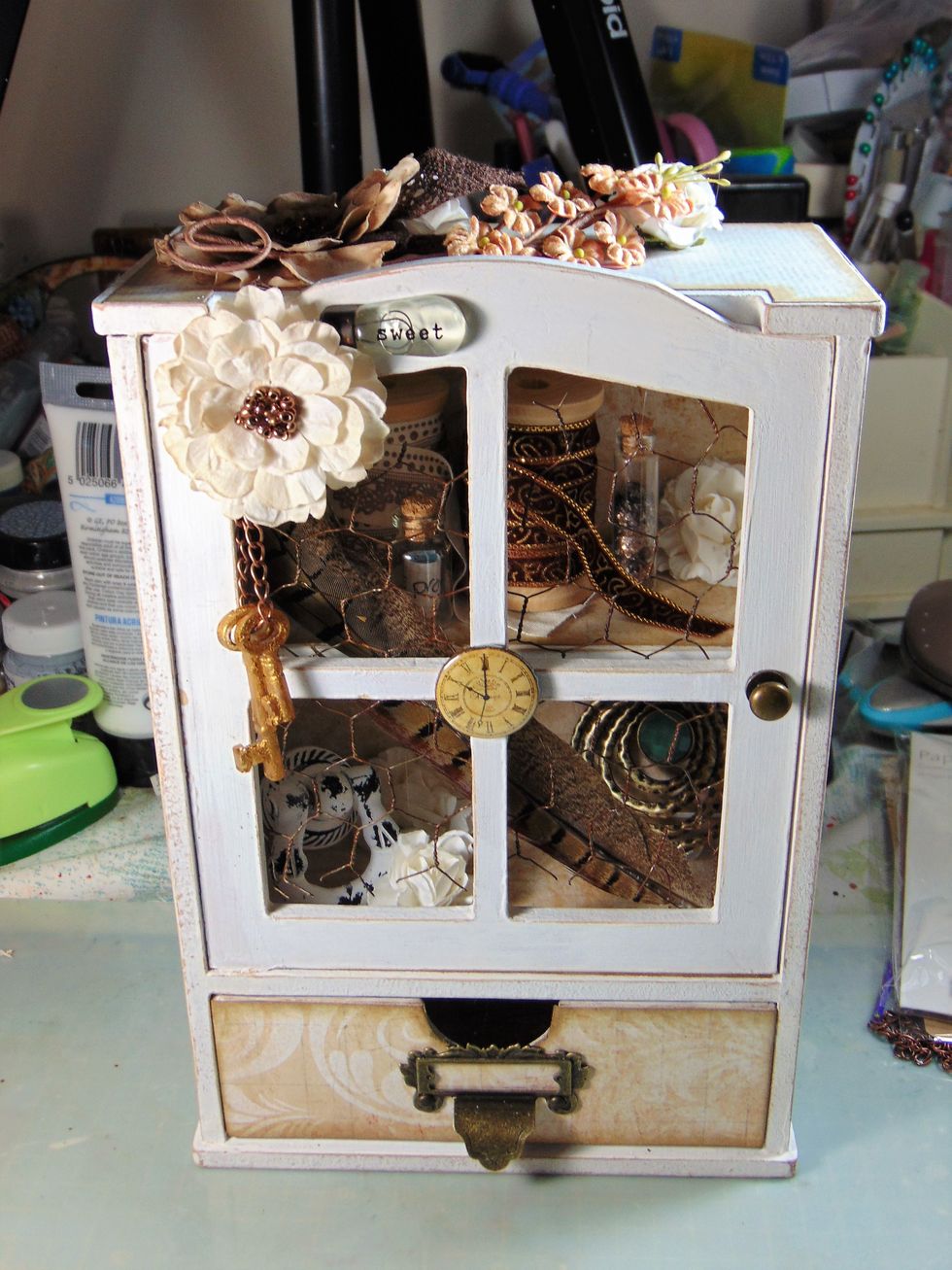 Add Graphic 45 label door holder to the front of drawer with the little brad fixings provided, its easy to skewer holes through the chipboard drawer to do this. Line the inside to cover split brads.