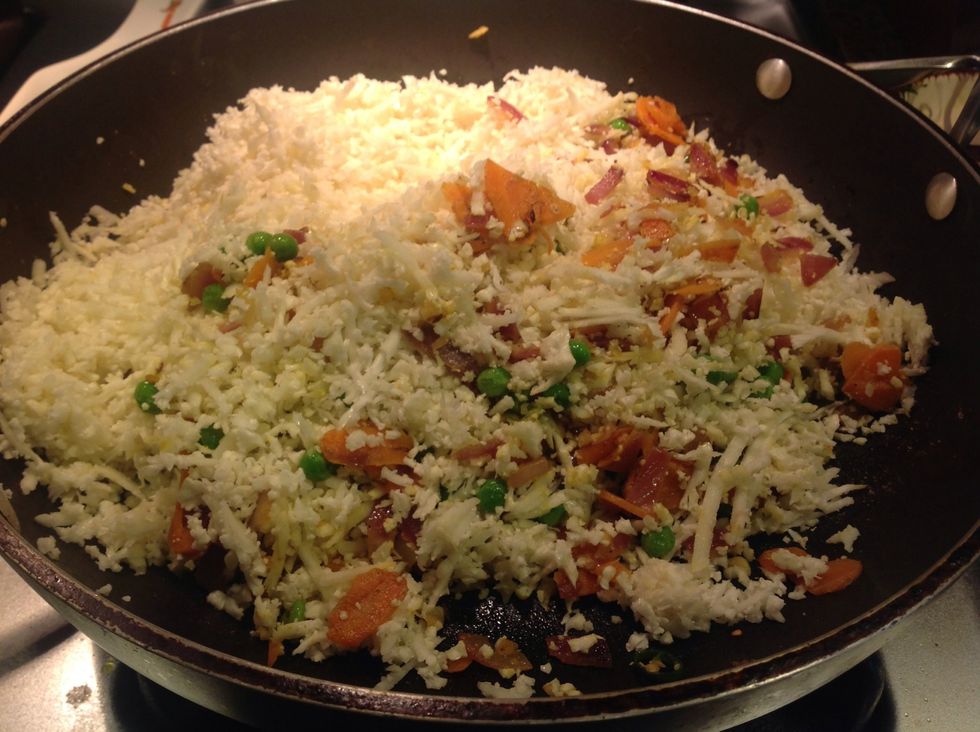 Add grated cauliflower.  I used my food processor to grate it, and it got the job done very fast!  Half a large head of cauliflower yielded about 4 cups grated.