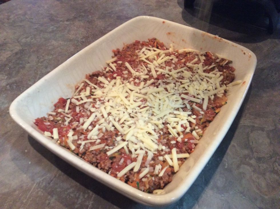Add grated cheese to cover meat.