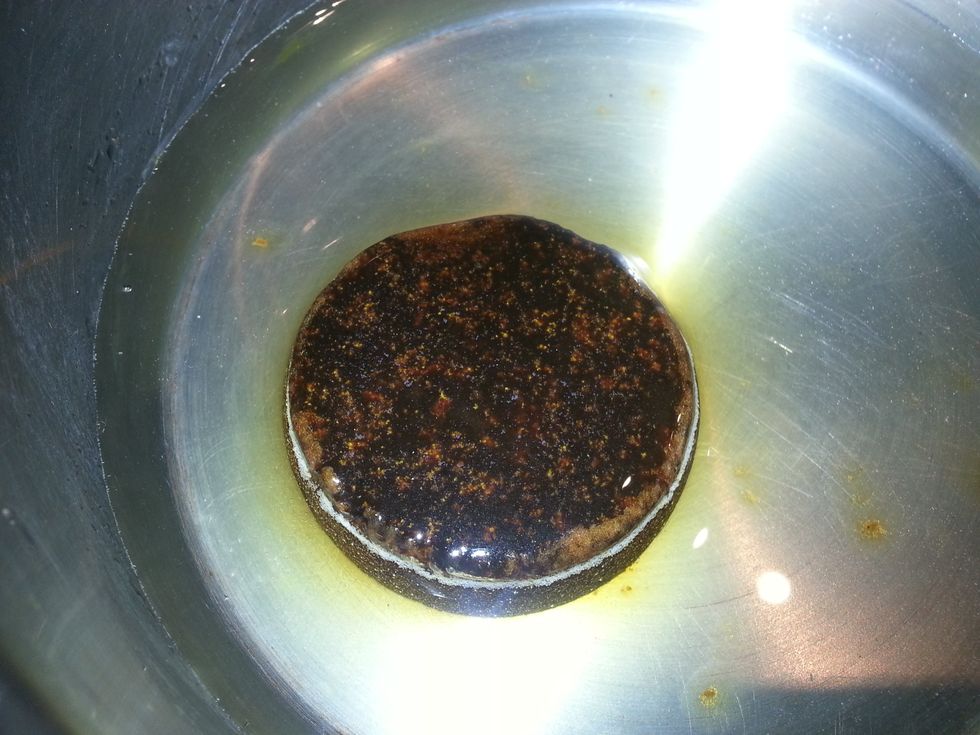 Add grated jaggery to 1 cup water, heat, and mix until dissolved