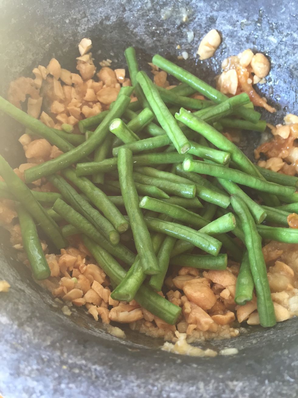 Add green beans and bruised it. Make sure the green beans don't fall apart.