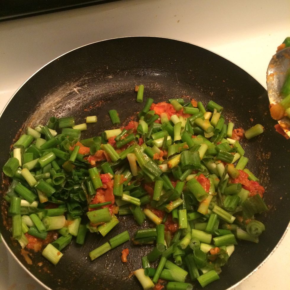 Add green onion now and saut\u00e9 for 4mins