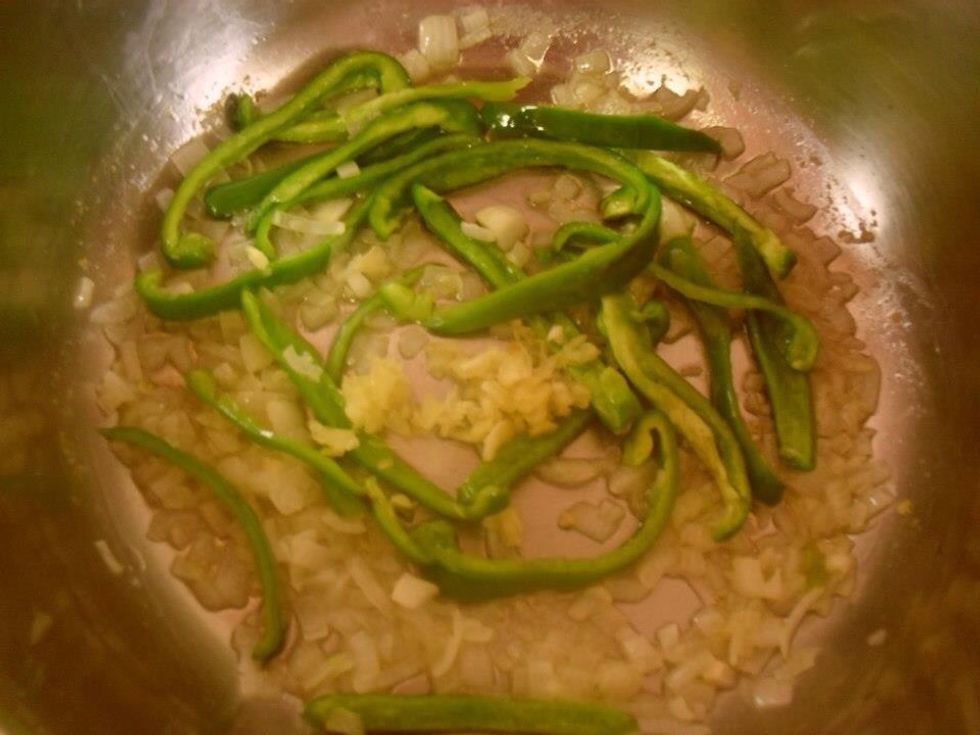 Add green pepper and garlic and stir the mixture