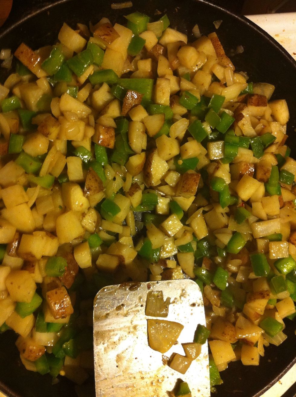 Add green peppers, onions, Emeril Essence, salt & pepper & mix well. Cook this mixture for 5 min remove from skillet and set aside.