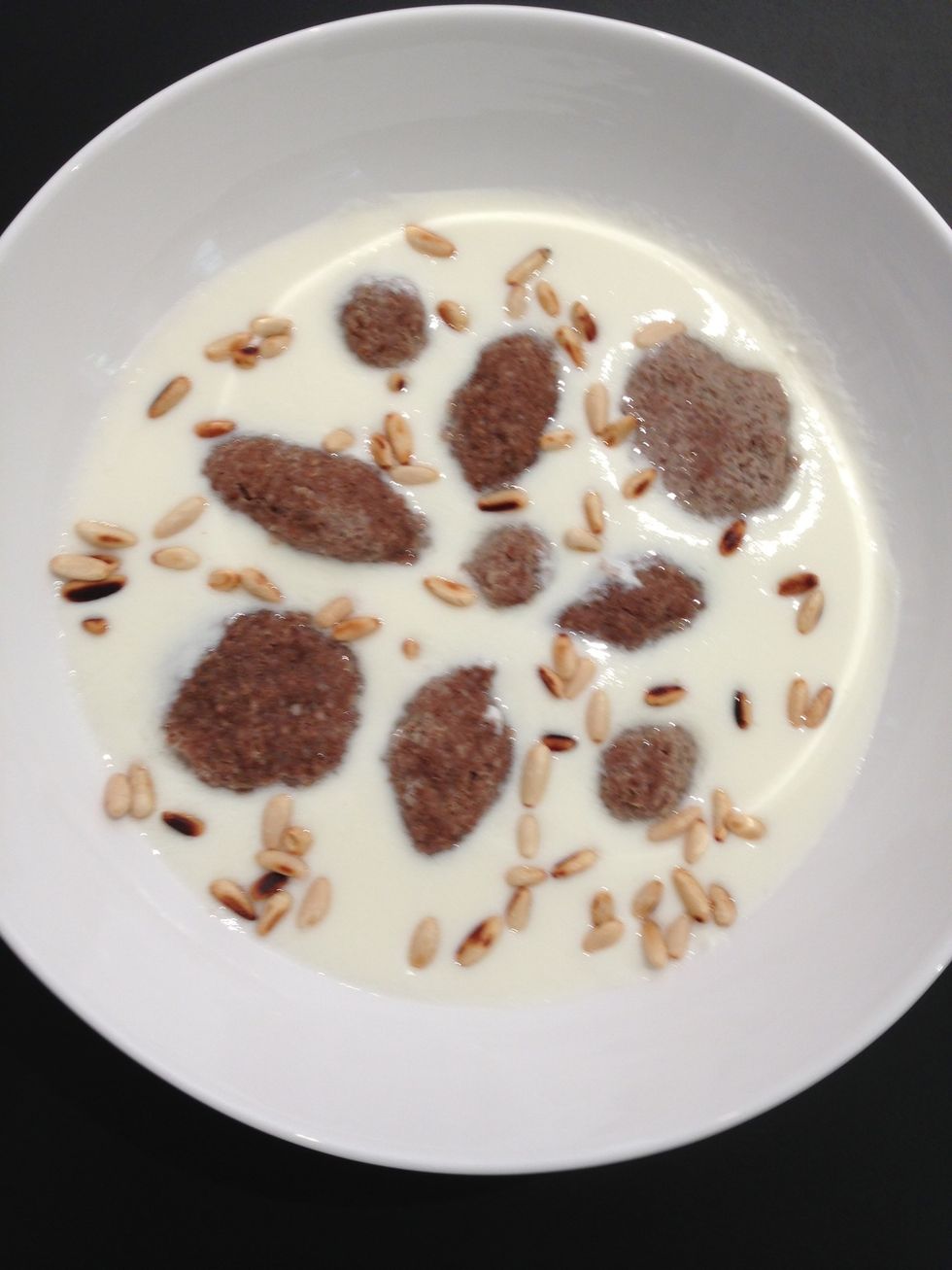 Add grilled pine seeds