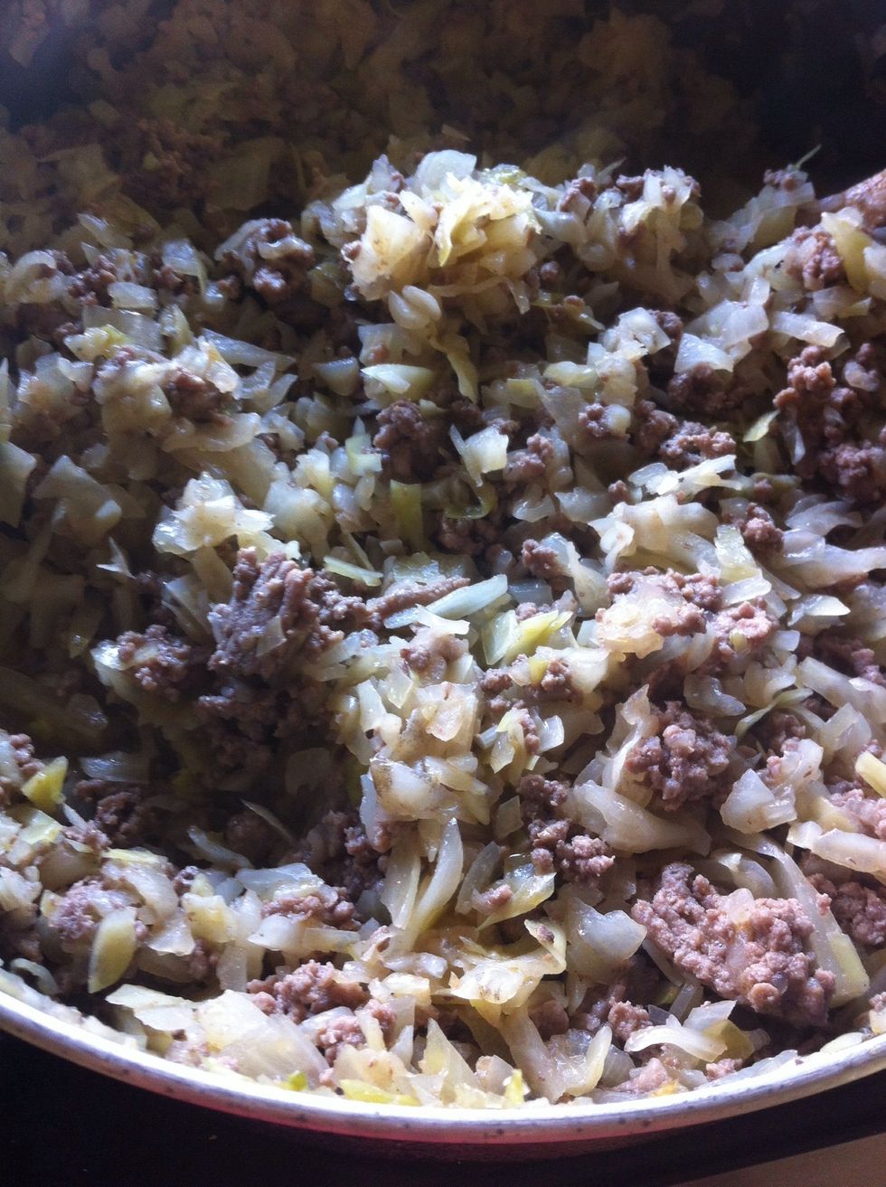 Add ground beef and cook it through.