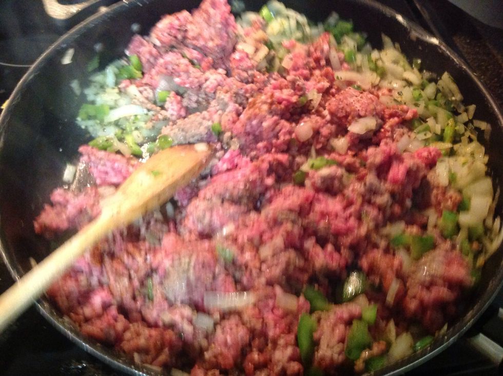 Add ground beef and cook until brown