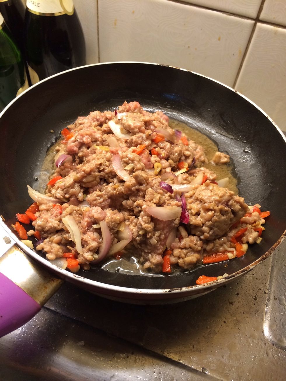 Add ground pork and cook till the pink is gone from the meat. Add fish sauce and stir fry another minute or two