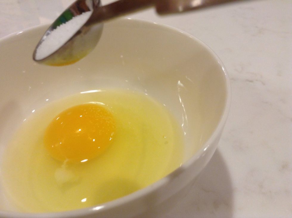 Add half a teaspoon of salt to the egg