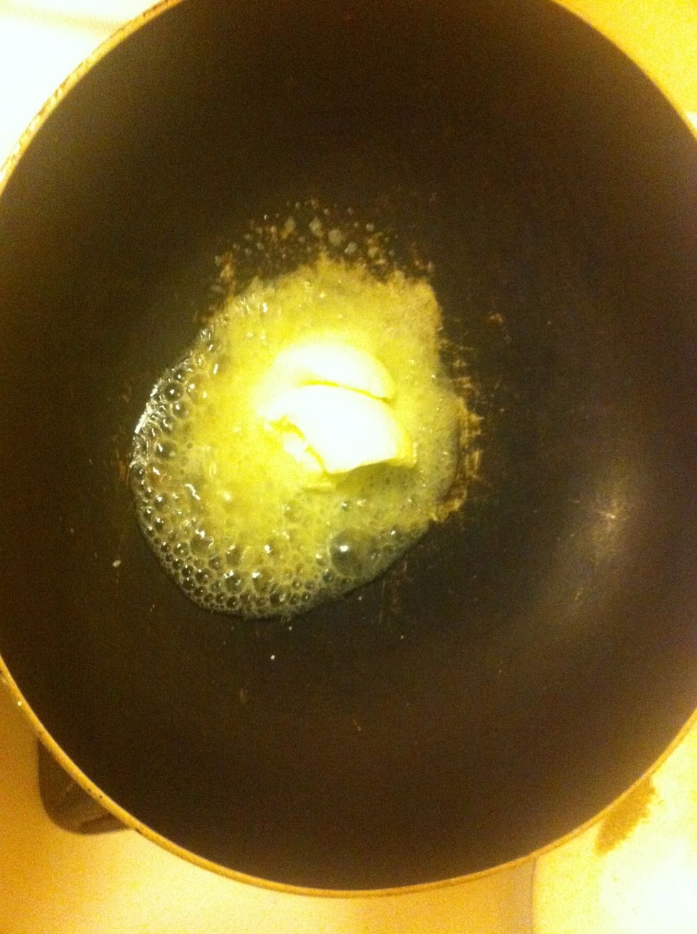 Add half if butter to pan and let melt.