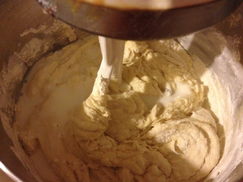 Add half if the sour milk and a cup of flour. Mix. Then repeat. To make the sour milk, add 1tsp of vinegar to the milk so it will curdle. This is the secret to the recipe.