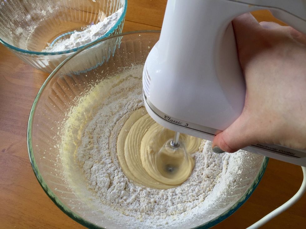 Add half of the flour mixture and mix it in on low speed.