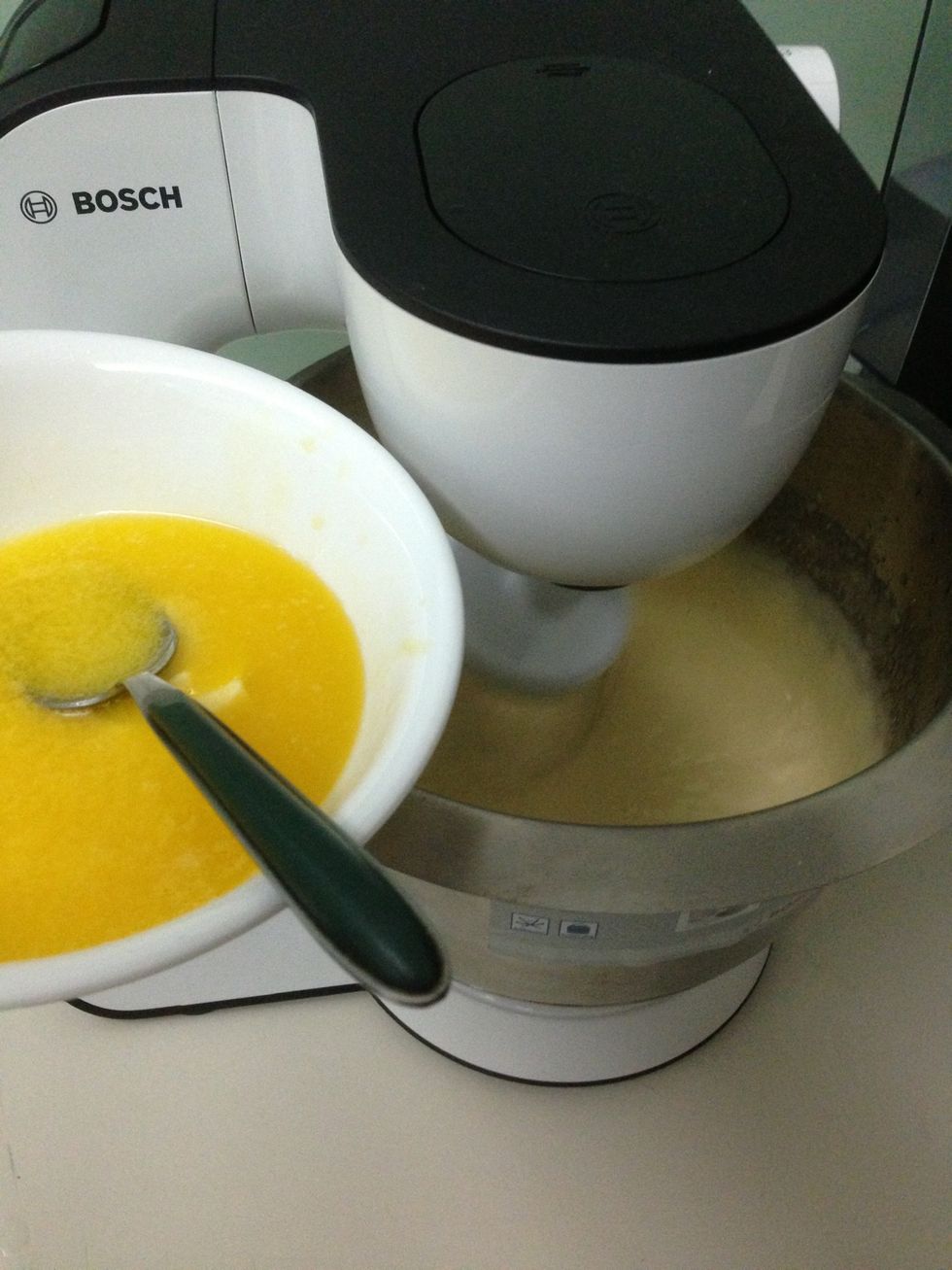 Add half of the melted butter and mix