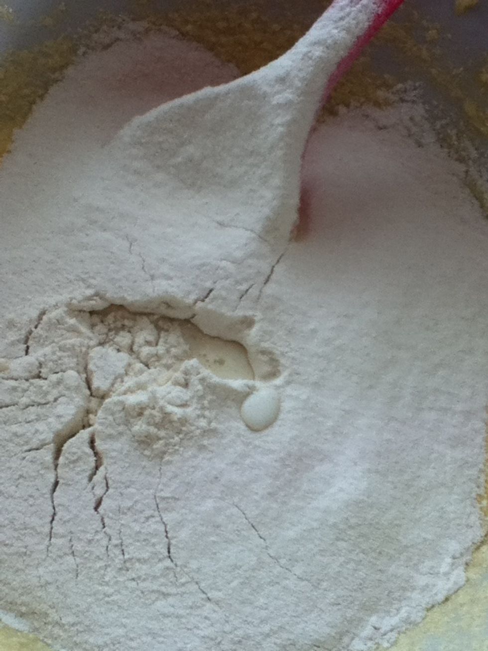Add half of the milk and sieve half of the flour into the bowl.