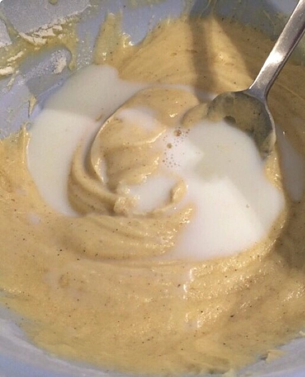 Add half of the milk.