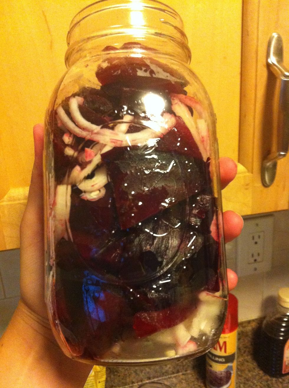 Add half of the onions to jar or Tupperware. Add beets. Add remaining onions. Snack on beets that don't fit.