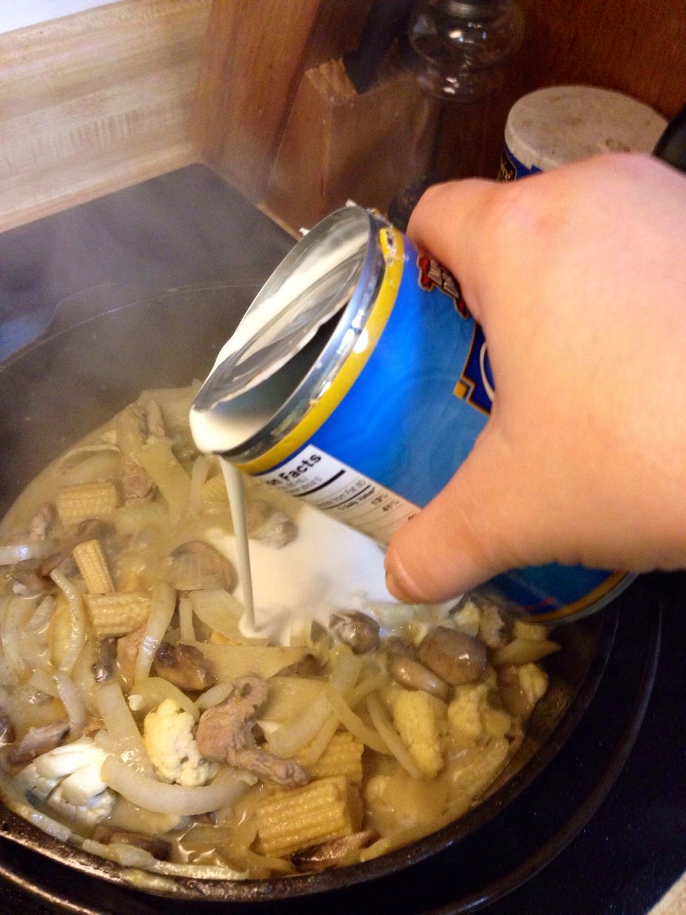 Add half of the other can of coconut milk, soy sauce, fish sauce, and lemongrass. Stir to combine and simmer and let reduce for 30 minutes.