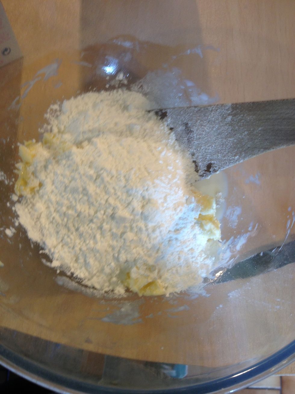 Add half the icing sugar and beat thoroughly.