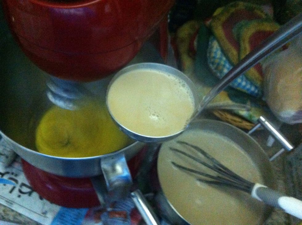 Add half the mixture into the egg yolks. I add it slowly and steady using a ladel.