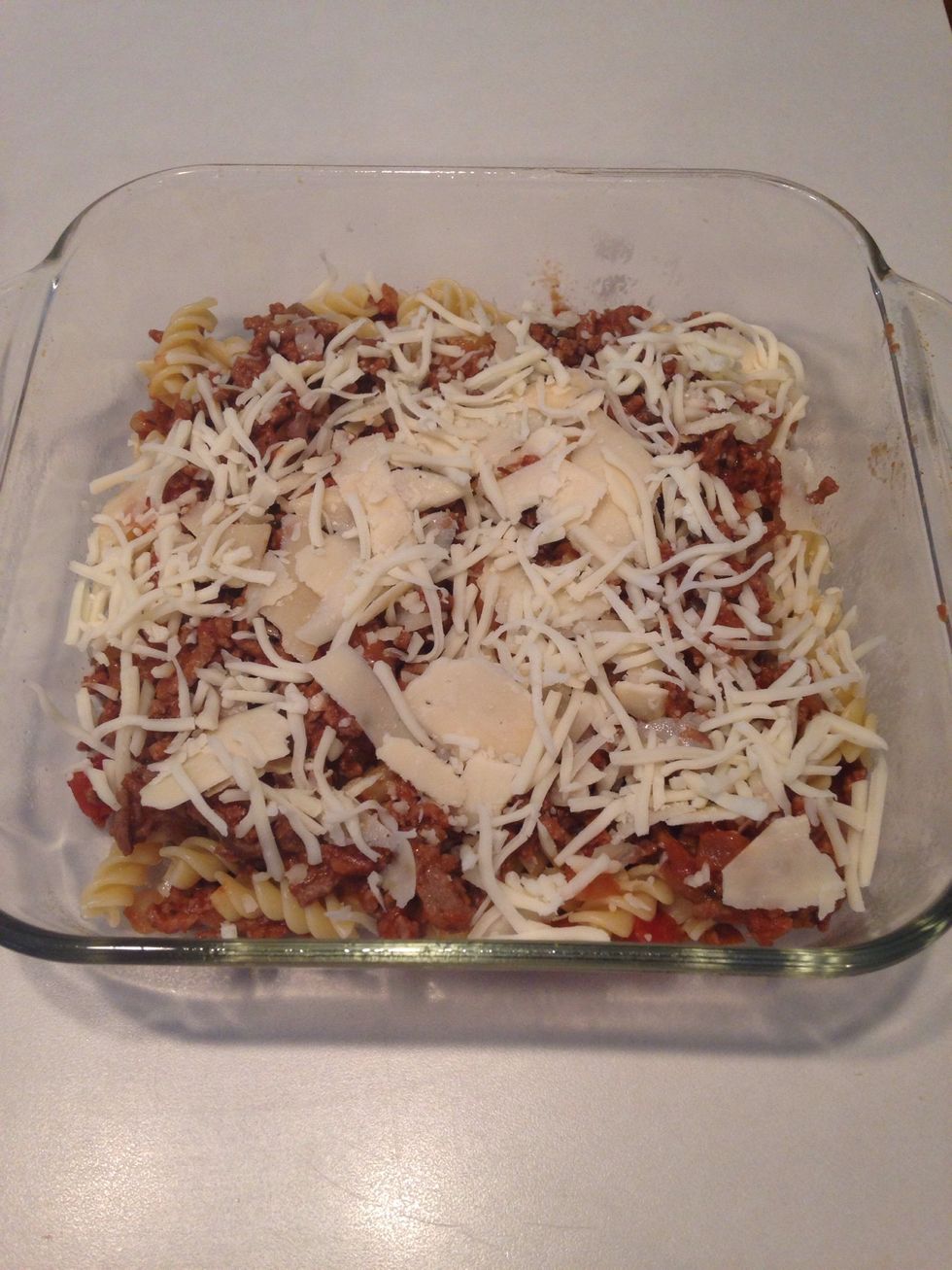 Add half the Parmesan and half the mozzarella cheeses.