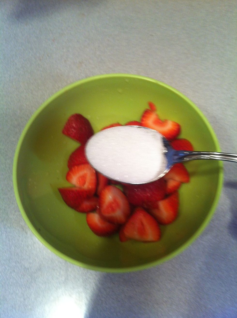 Add half to the strawberries.