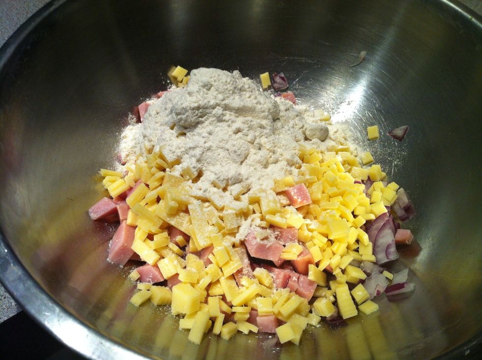 Add ham, onion, cheese and self raising flour in a clean bowl. Mix well.