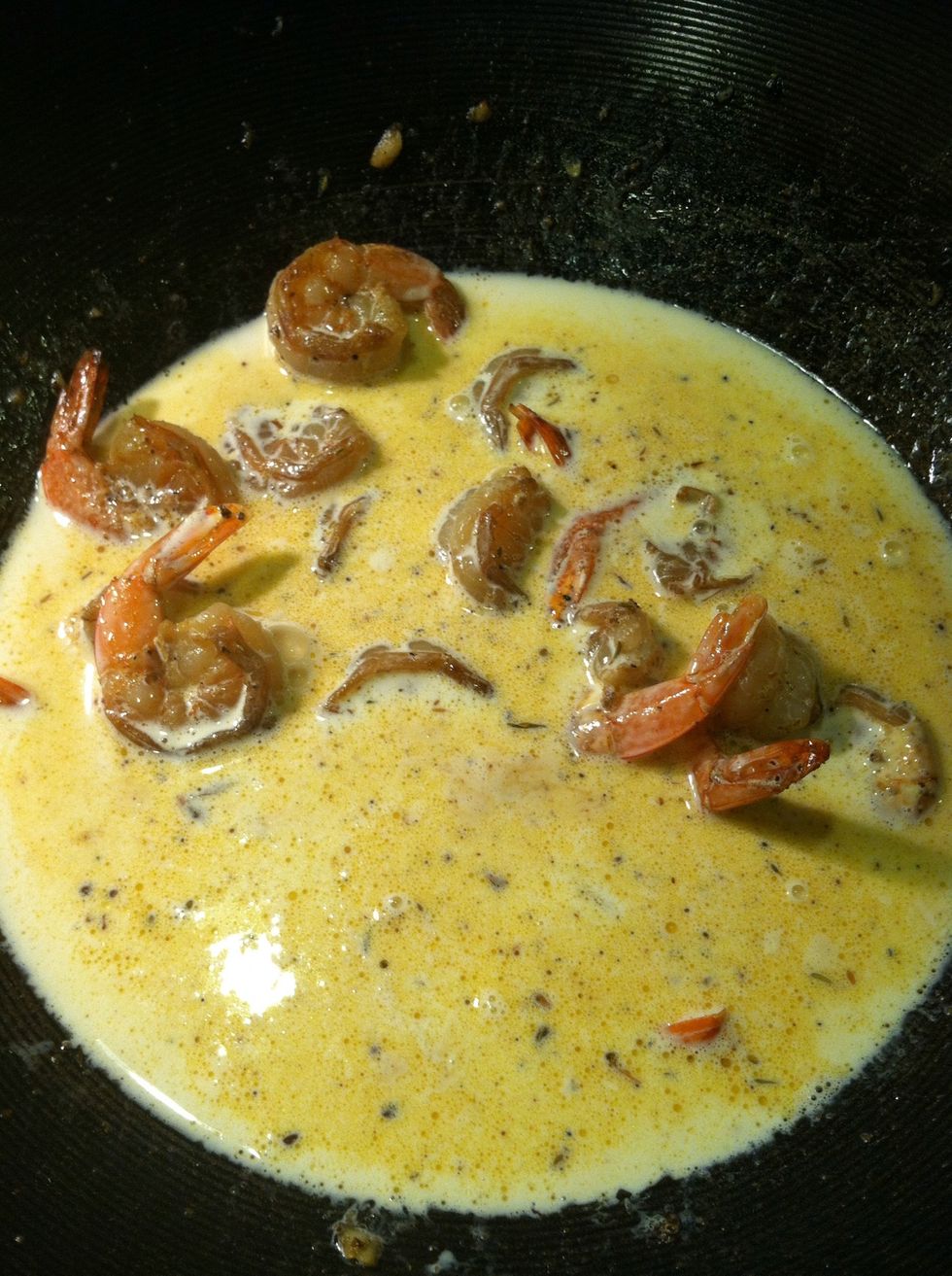Add heavy cream, simmer until reduced to about 1/2. Add paprika and Cajun seasons for color.