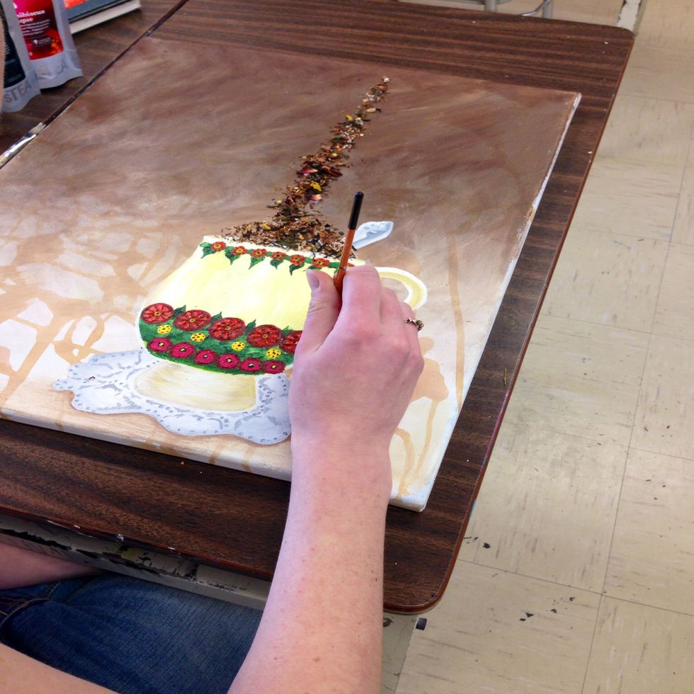 Add highlights with white paint in order to add light to the teacup.