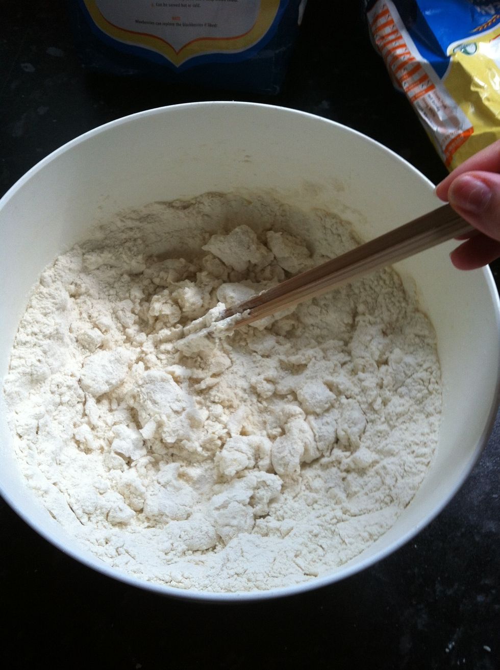 Add hot water to flour and mix with chopsticks...