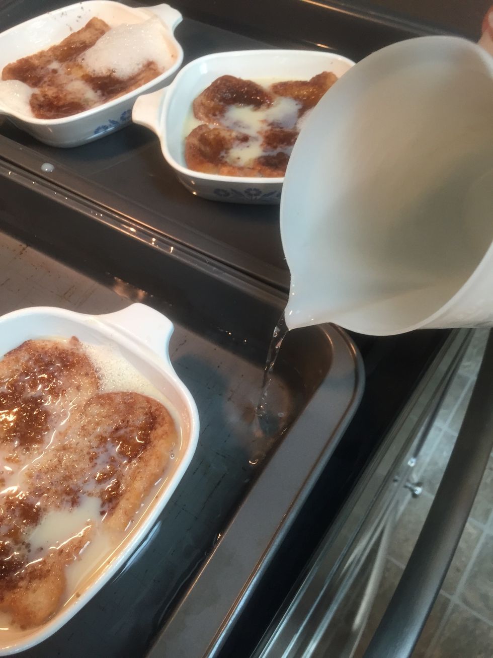 Add hot water to the outer pan as shown.  Be careful carrying to oven! Sometimes I add water once it's on the oven rack.
