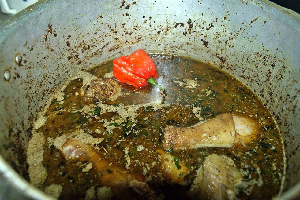 Add hot water to the pot. Make sure it's hot water so you don't stop the cooking process. Just put enough water to cover meat. Add the hot pepper, reduce flame to medium and cover for 5 to 10 mins.