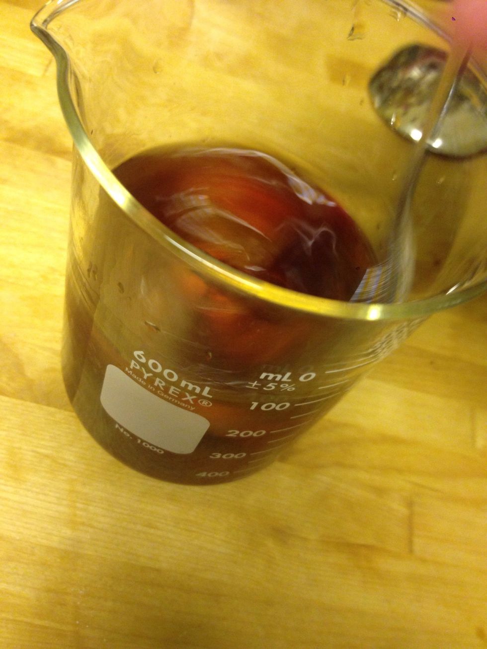 Add ice and stir. Pro tip: you're stirring correctly if you don't hear clinking of ice and spoon.