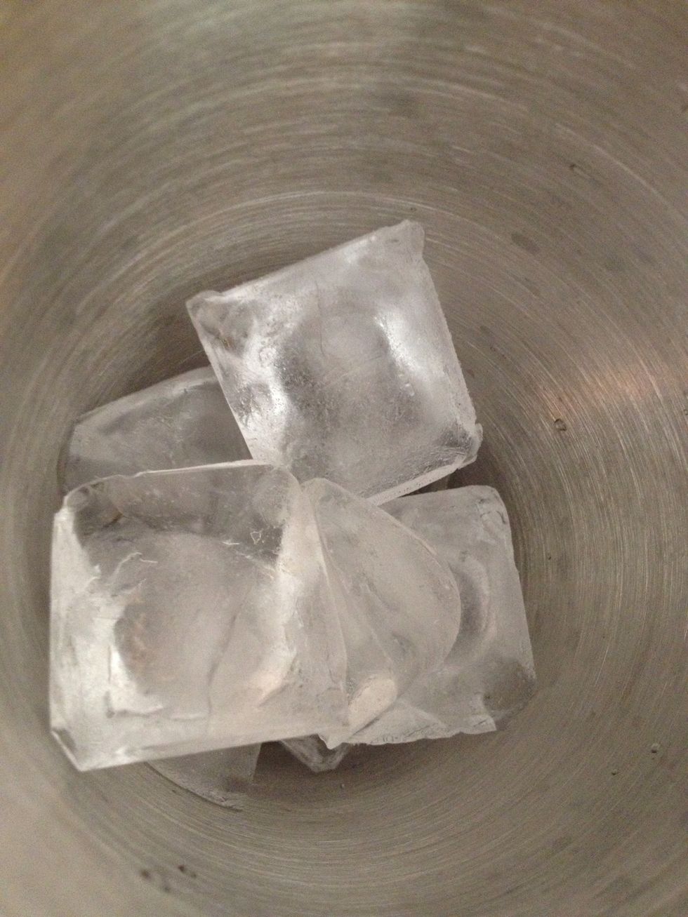 Add ice cubes to a martini shaker
