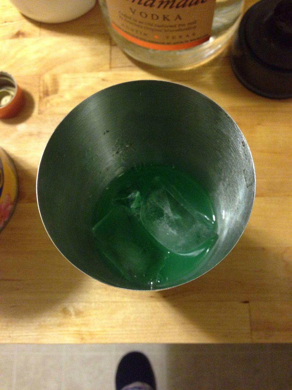 Add ice to the mixer and shake.