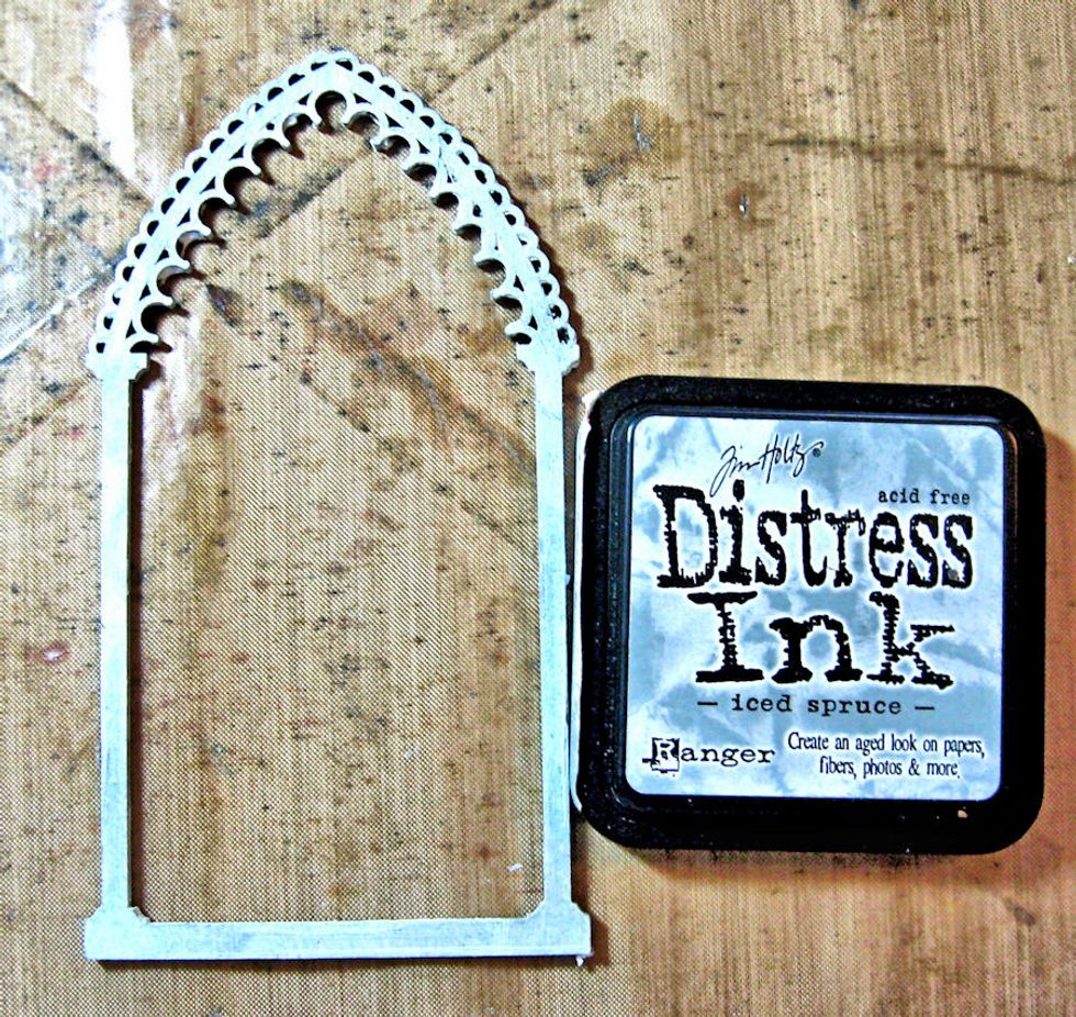 Add Iced Spruce Distress Ink to the top portion of the Reliquary Arch Frame.