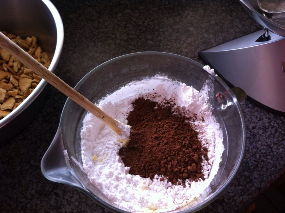 Add icing sugar and cocoa to the melted butter and mix well.
