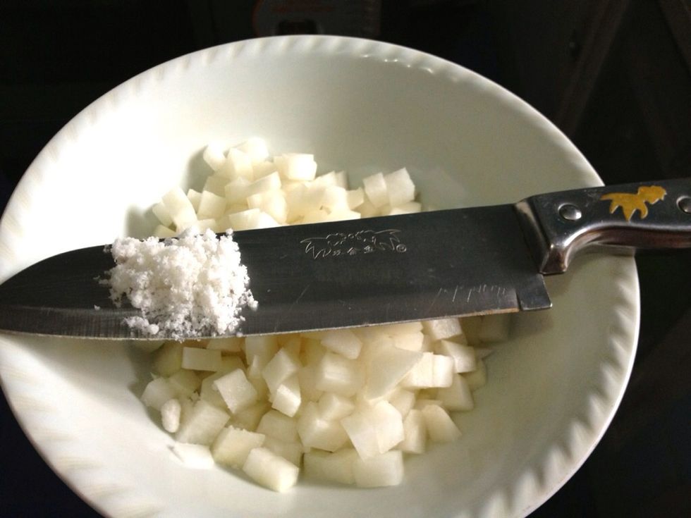 Add in 1/4 cup + 1/2 tsp table salt to the daikon cubes. The original recipe calls 1/4 cup of kosher salt