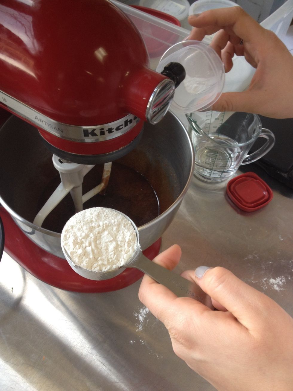 Add in 1/4 of the flour and all of the baking soda