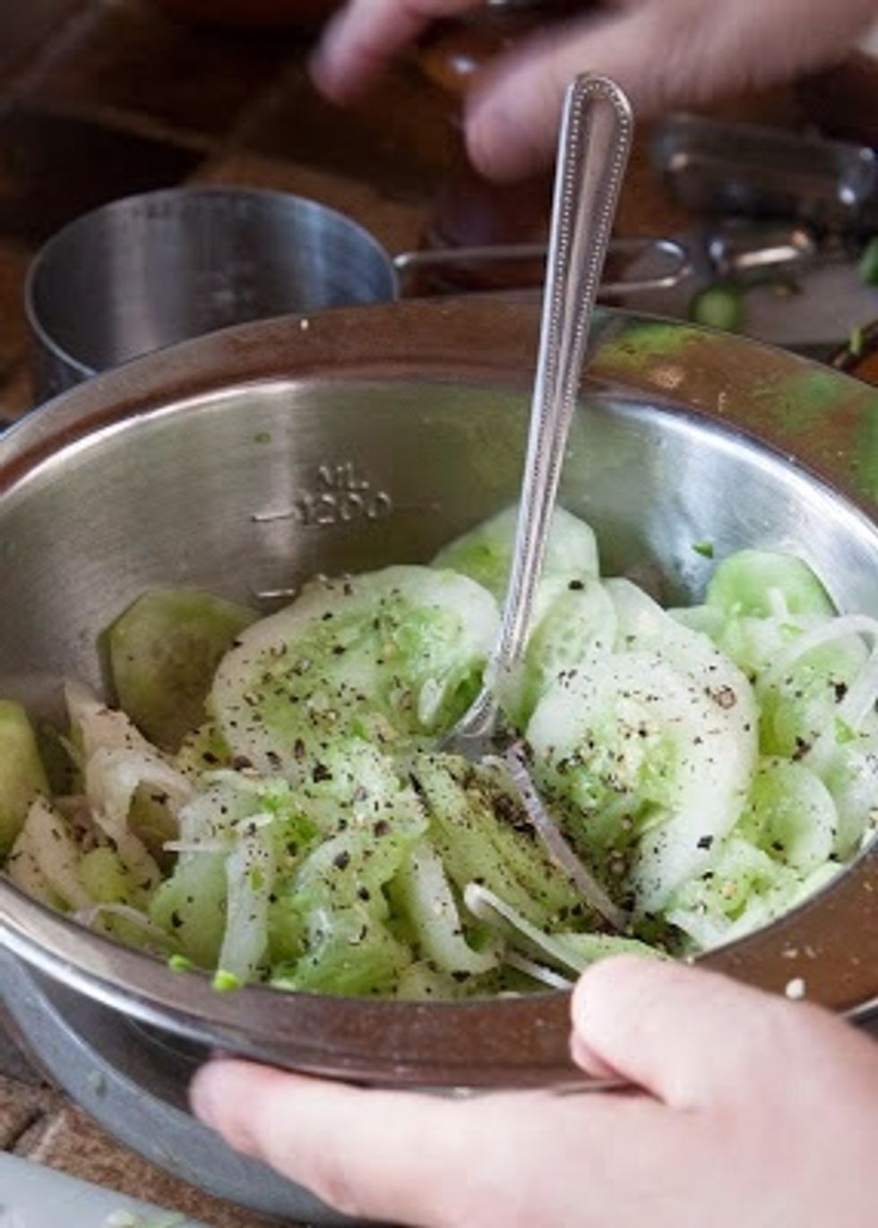 Add in 1 and 1/2 tps of kosher salt and the ground black pepper. Mix it all together well