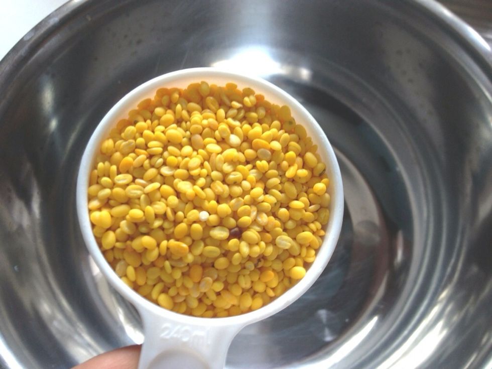 Add in 1 cup (approx. 225gr) split mung bean into a large bowl. Wash the mung dal twice and drained the excess water. Add in 4-5 cups of water. Cover with a lid and soak it 3-4 hours or overnight