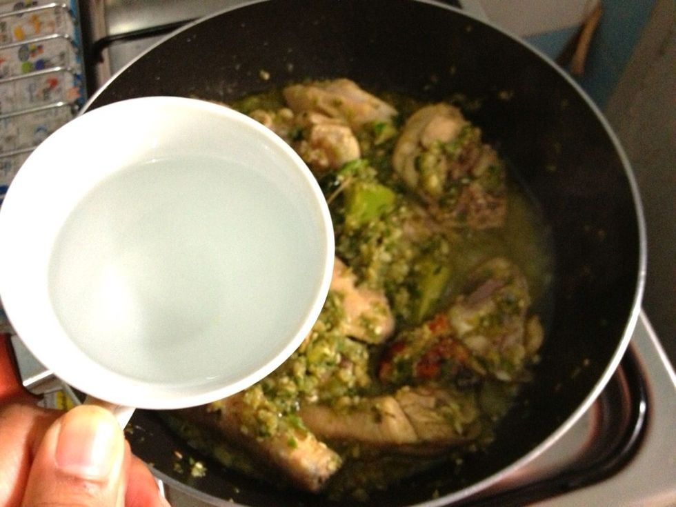 Add in 150-175ml of water. Reduced heat. Simmer for about 30-40. Cover the pan in the first 15 mnts and let it simmer uncovered until the chicken fully absorbed the liquid. Turn off the heat