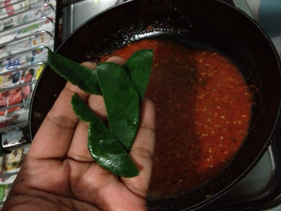 Add in 2 kaffir lime leaves. Dont forget to Tear and remove the stem
