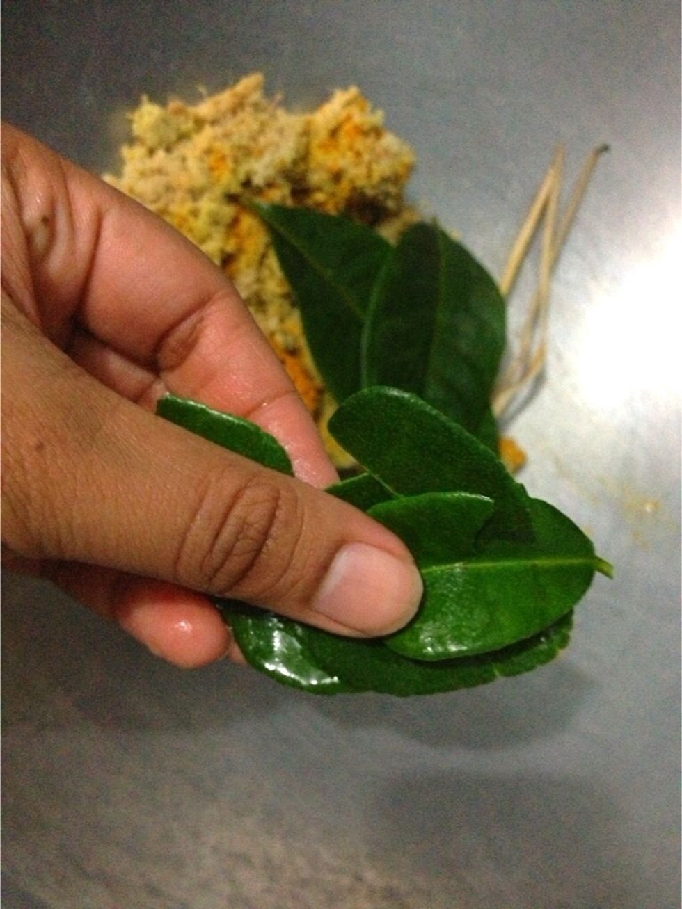 Add in 3-4 kaffir lime leaves. Tear the leaves