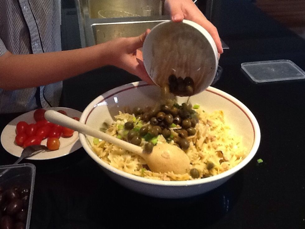 Add in a 100g of Spanish green olives into the bowl