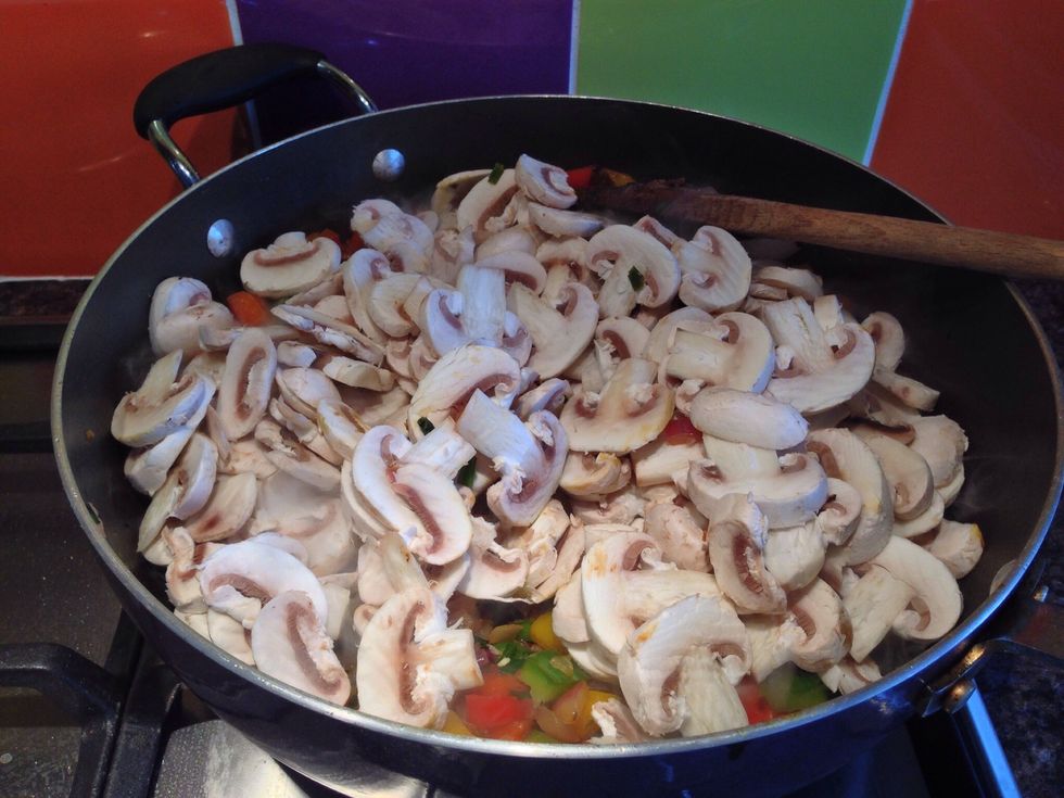 Add in a load of chopped mushrooms and cook down until reduced